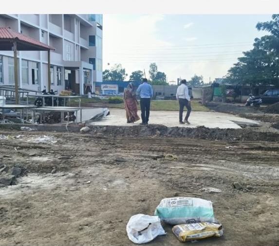 Team reviewing the prepared ground and site layout at Sinnar