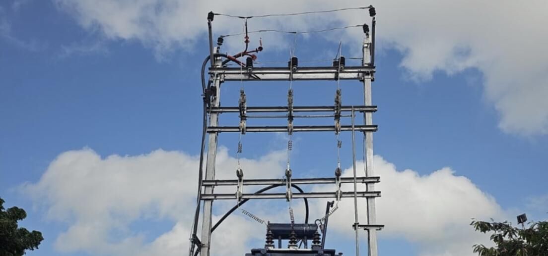 Electrical transformer structure at the Sinnar site against a blue sky
